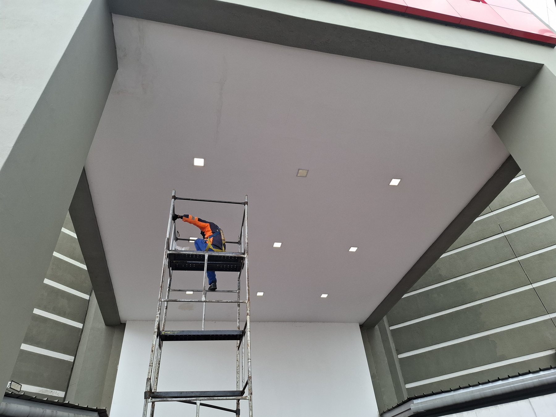 Canopy ceiling showing mix of new and old light fittings