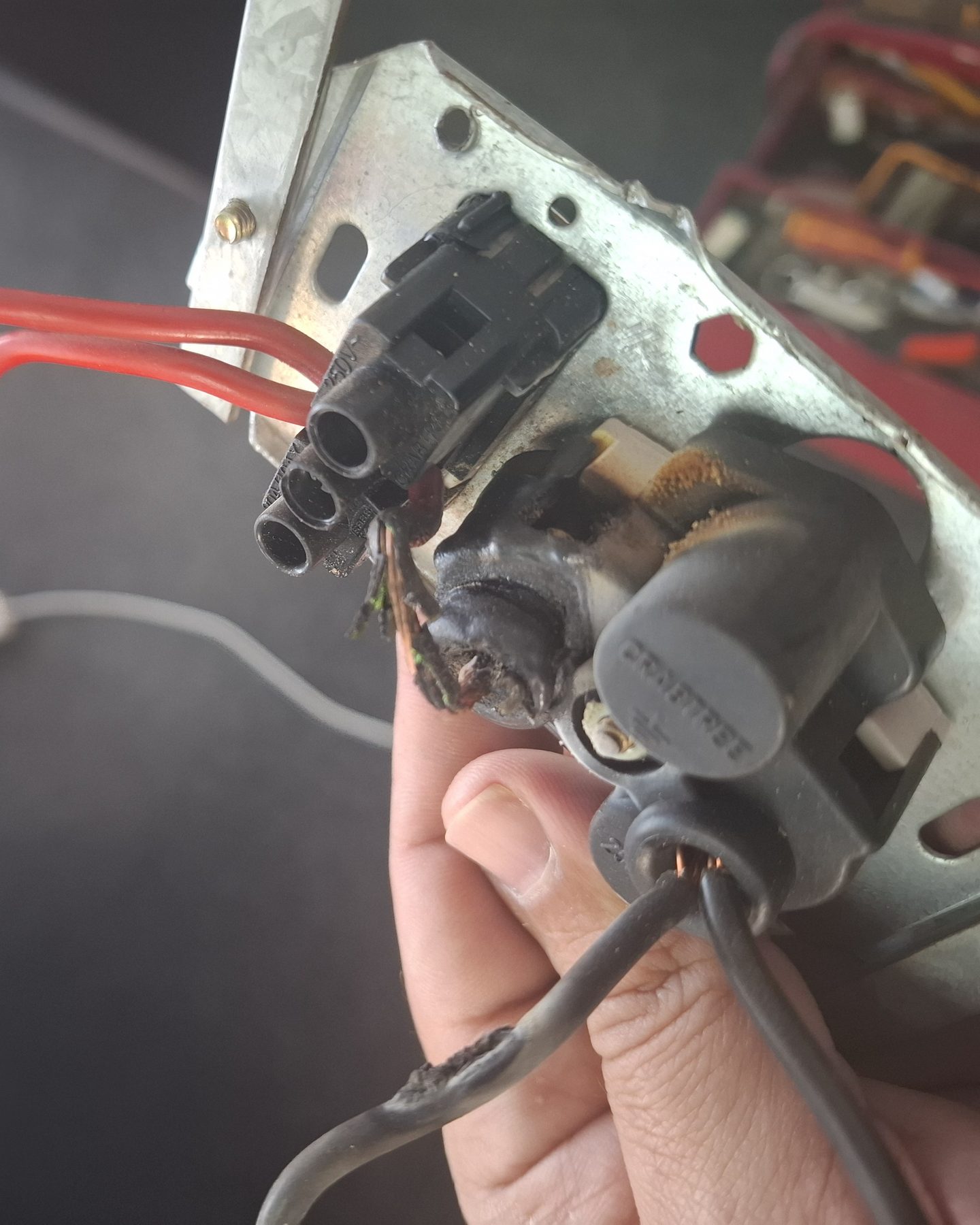 Burnt wire connector removed from the mounting box