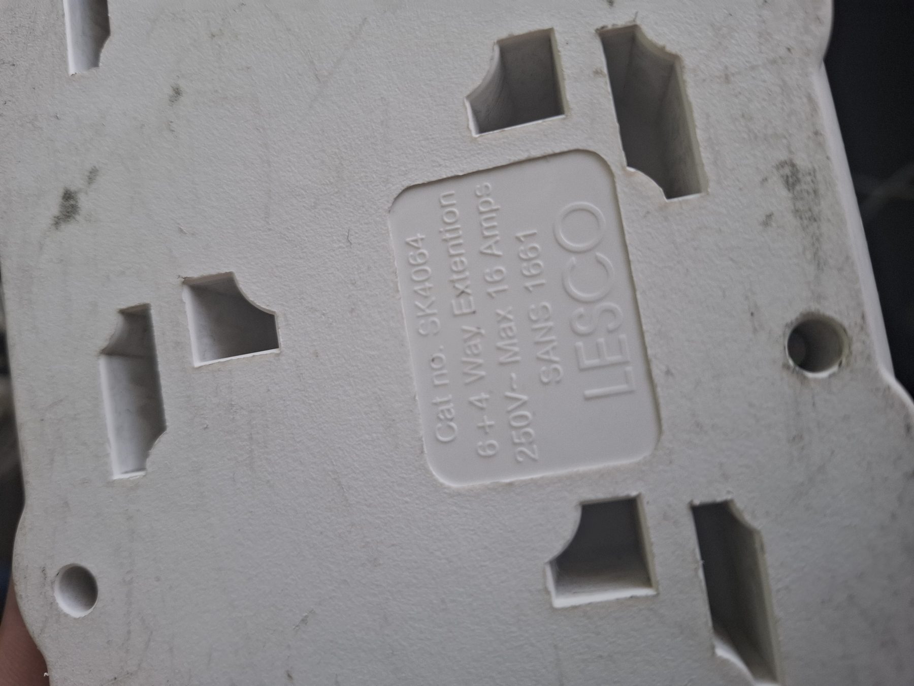 Close-up of the multi-plug rating label reading 250V, max 16 amps, SANS 1661