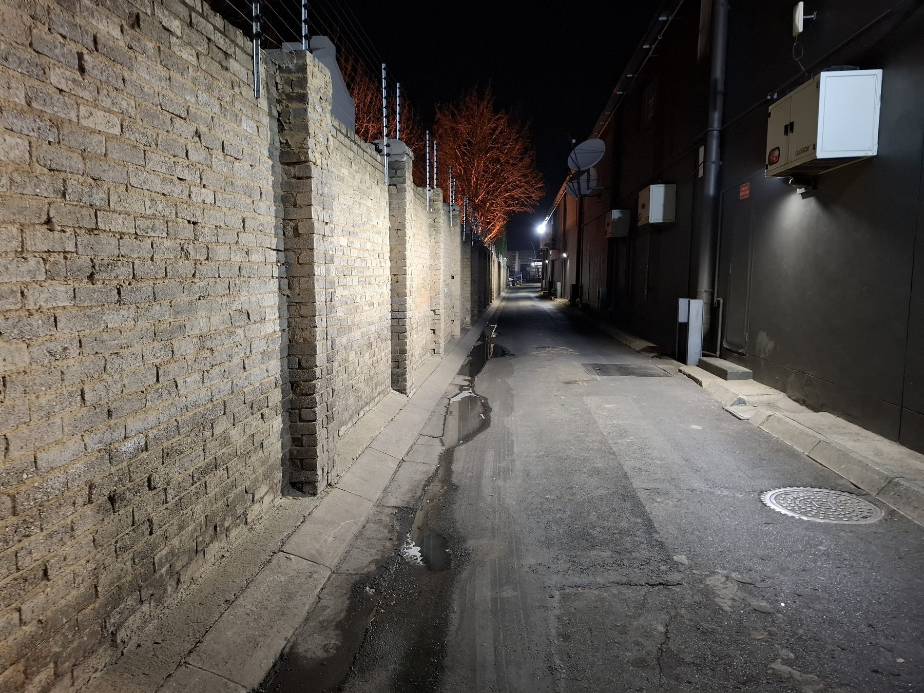 Rear service alley lit by new lighting